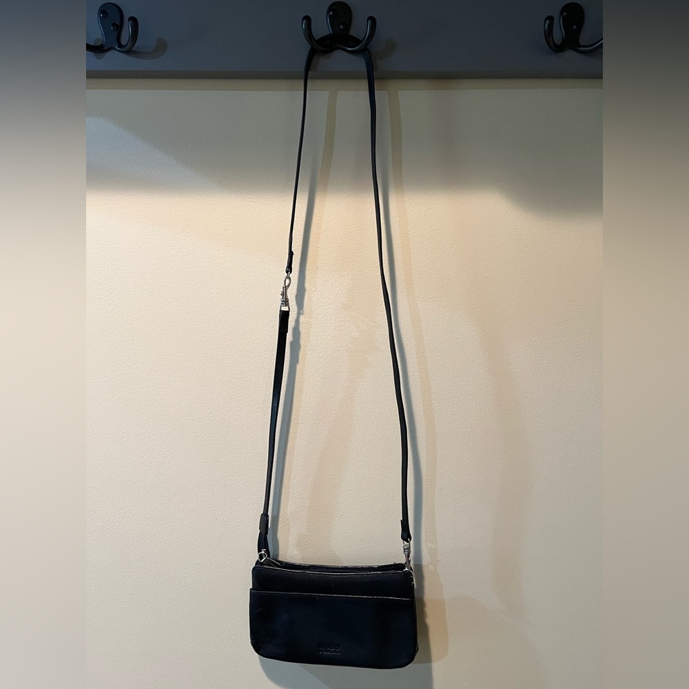 Hobo crossbody black bag with red interior, slim and light weight.